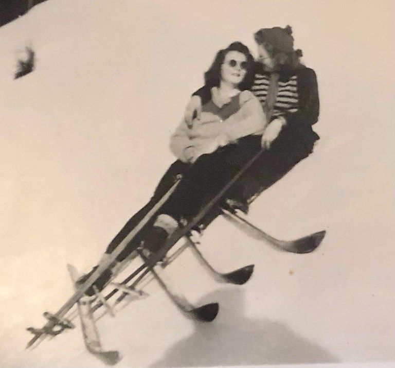 Roommates Ruth Goplen and Ingrid Lima in typical outfits of the time, with Norwegian wooden skis and bamboo poles.